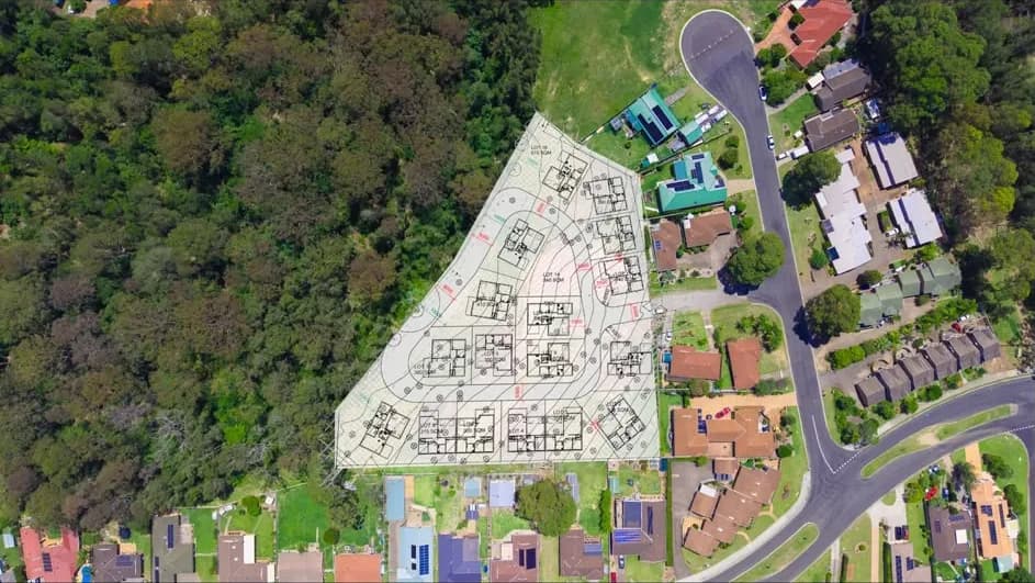 Top-down aerial photograph of the Sunshine Bay site with the concept lot layout drawn over it