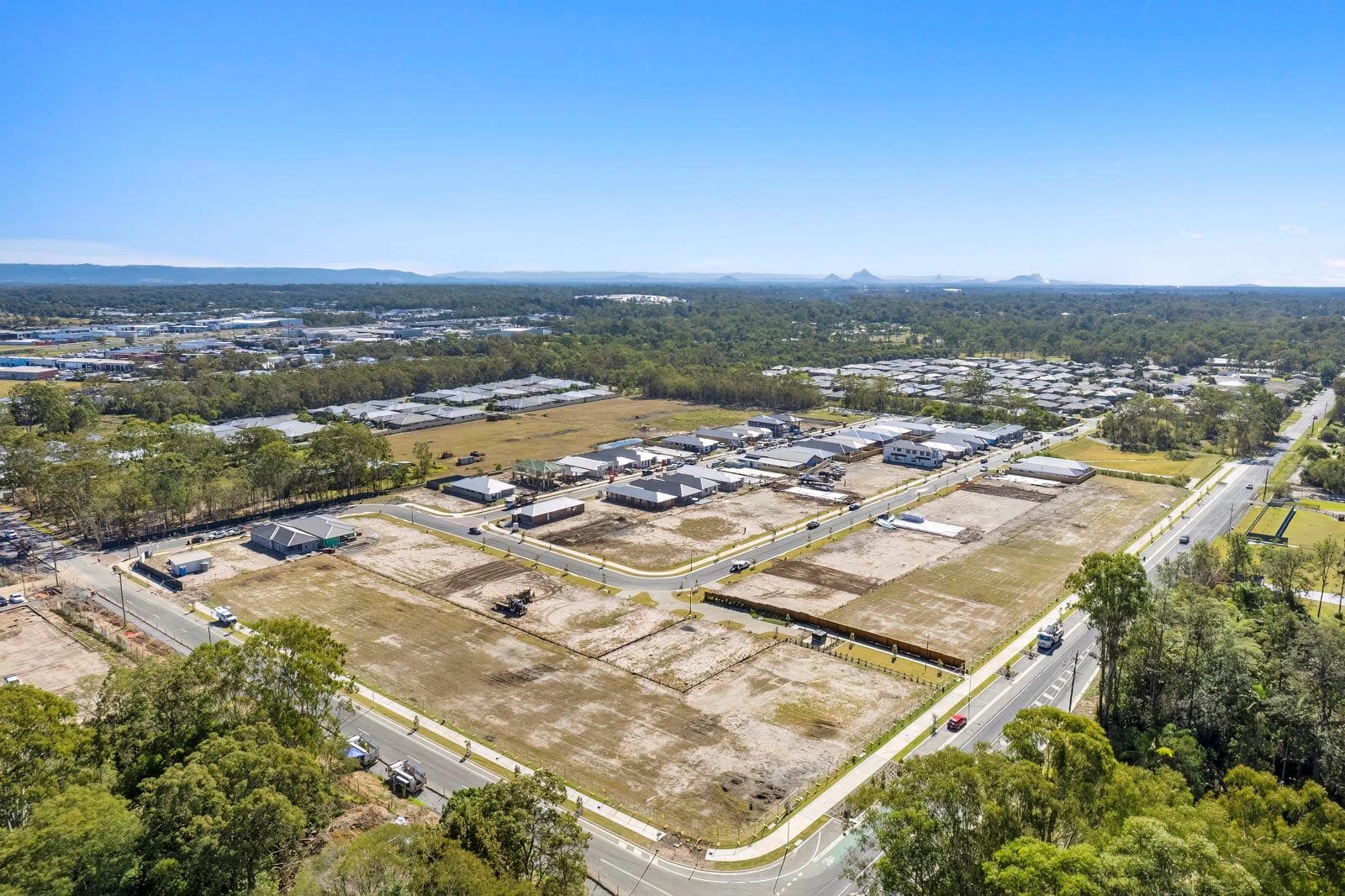 Aerial view of the delivered Reliance estate at Burpengary, Moreton Bay, with the Glass House Mountains on the horizon