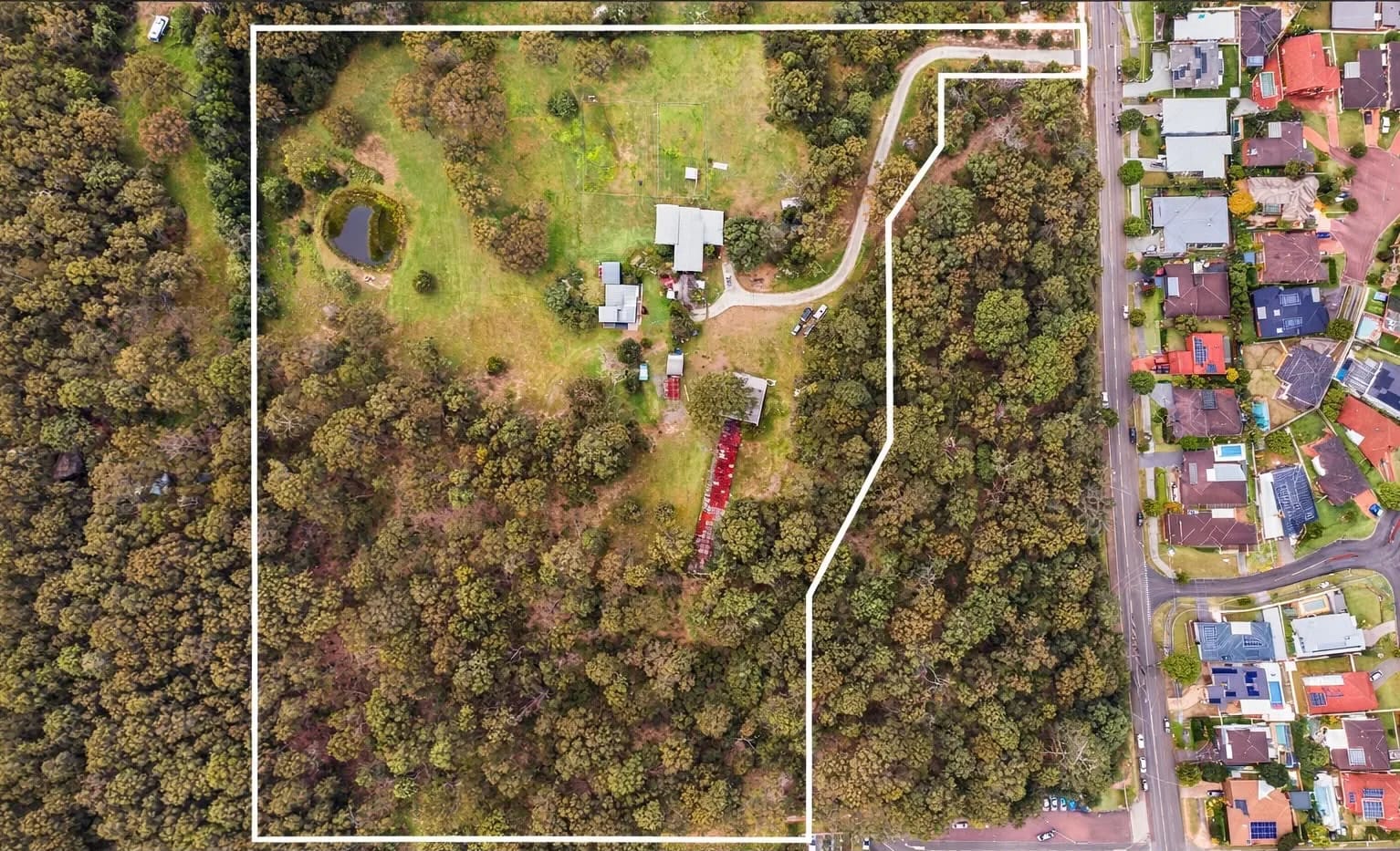 Aerial photograph of the Mataram Grove Estate site at Woongarrah with the development boundary marked against the neighbouring streets