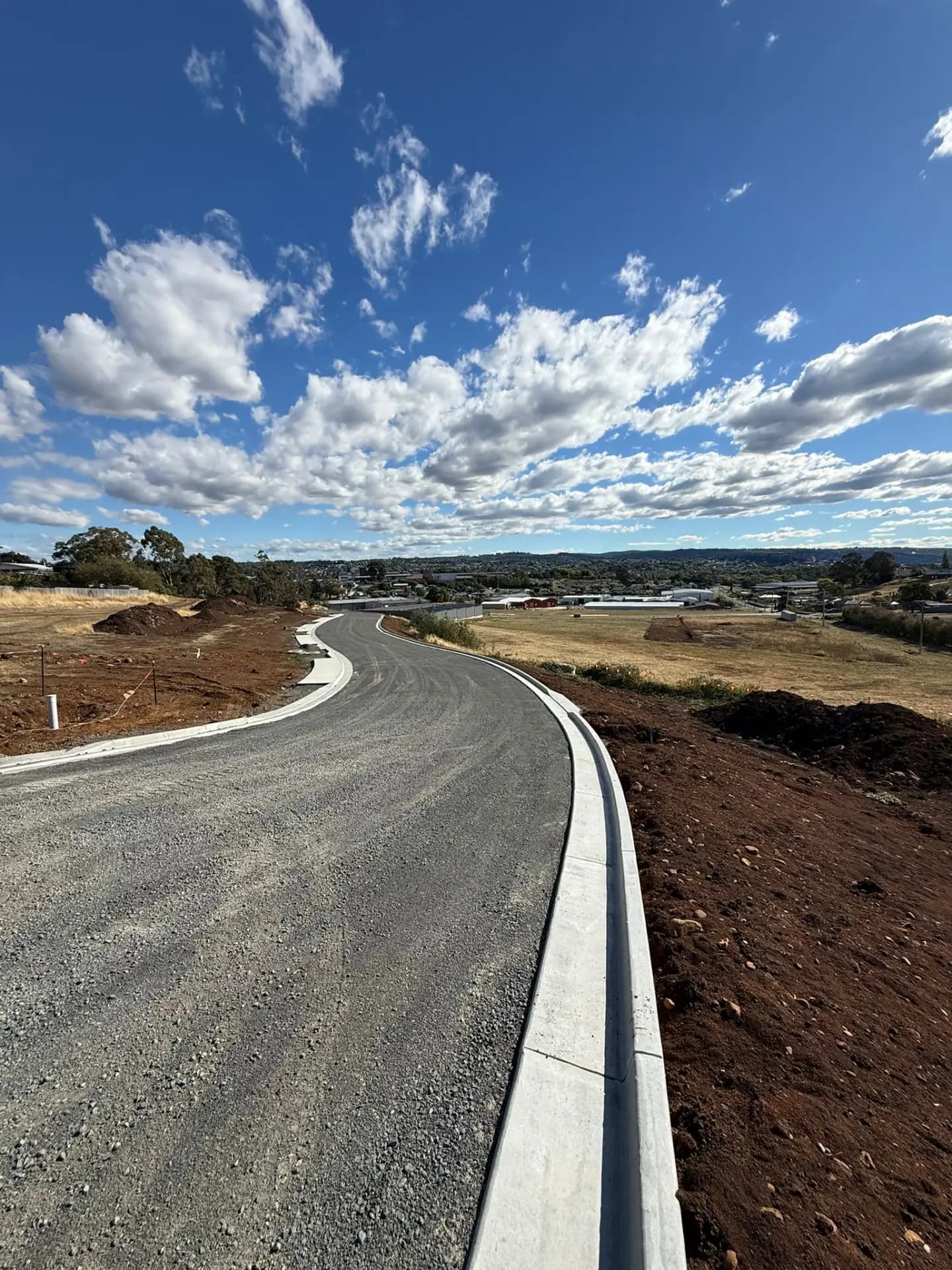 A newly constructed road curving through the Waverley subdivision at Launceston, Tasmania